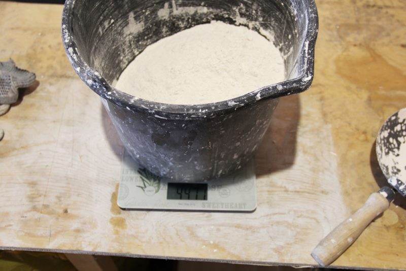 Dry gypsum weighing on an electronic scale