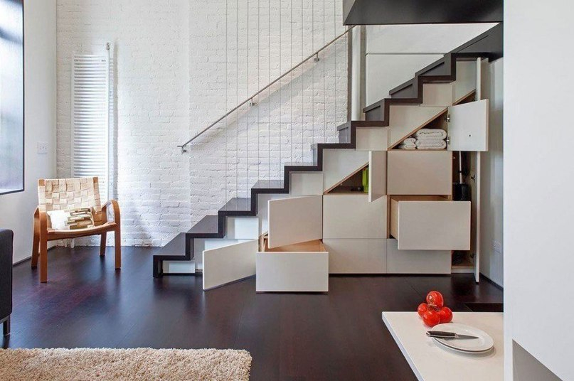 Convenient drawers under the stairs to the second floor of the apartment