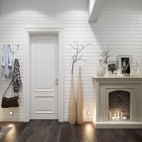 Decorative fireplace in the hallway of a country house