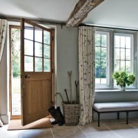 Design entrance hall with a window in a rural house