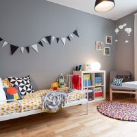 Garland of flags on the gray wall of the children's room