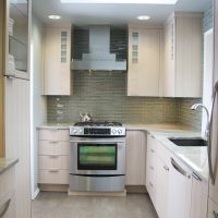 Design of a modern kitchen with a sink at the window