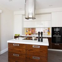 Hood above the kitchen island with drawers