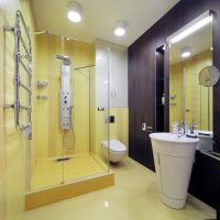 Yellow tile on the wall of the shower