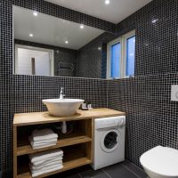 White terry towels on wooden shelves.