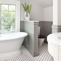 low partition in the bathroom of a rural house