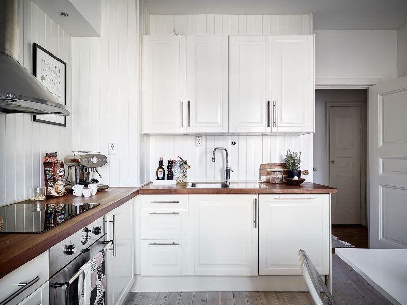 Corner kitchen of a private house in white