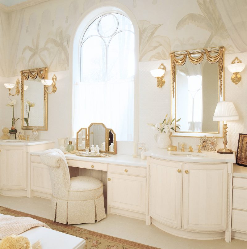 Two mirrors on the wall of a classic bathroom