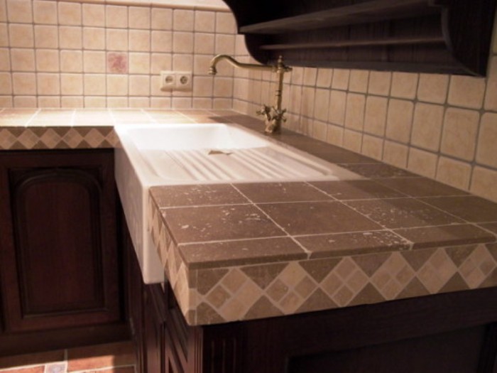 Features of a kitchen countertop made of stone.