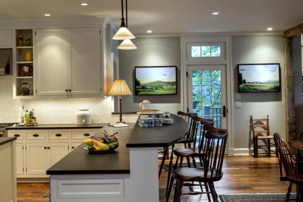 A two-level bar counter combines working and dining areas