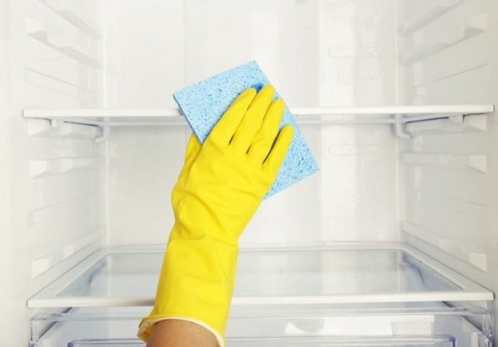 Cleaning the refrigerator.