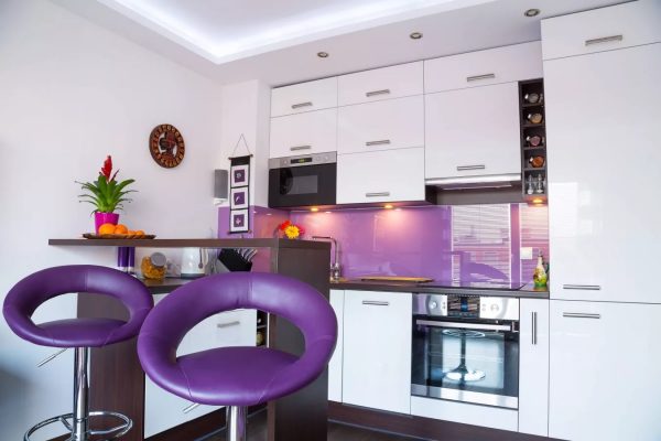 White kitchen in any case looks expensive, but you can add bright elements in one color scheme