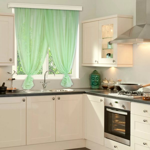 For a small kitchen, curtains of light color are suitable.