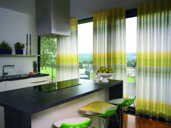 For a large kitchen, you should choose bright curtains