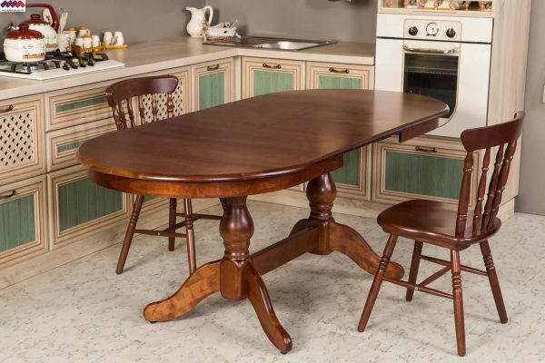 An additional way to save free space is a folding oval table for the kitchen